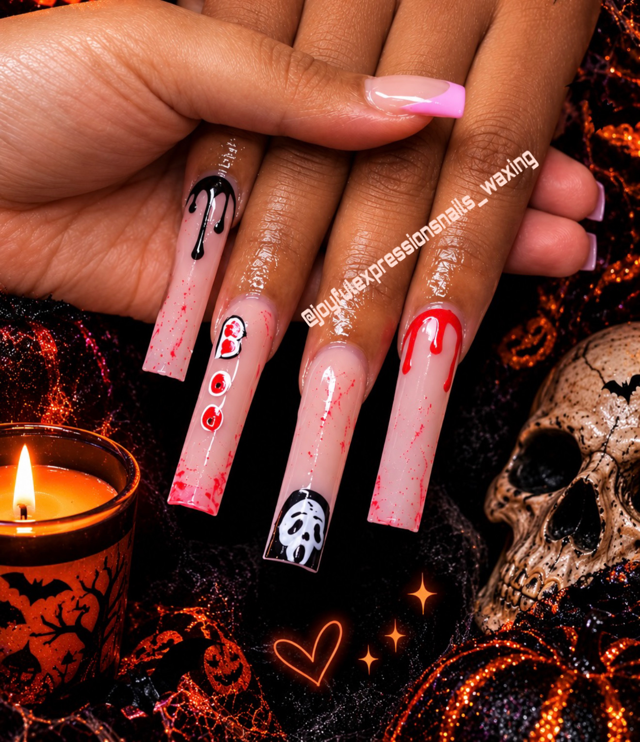 Halloween acrylic nail art by Joyful Expressions featuring red drips, black drips, blood splatter, and ghost designs